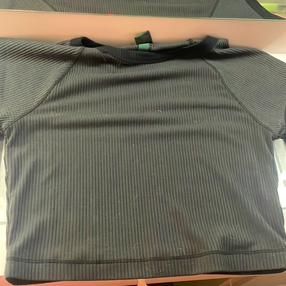 loose black shirt with black rimmed edges